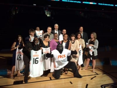 The Phoenix Suns' mascot, the Gorilla, poses with members of the Democratic National Convention's technical advisory committee at US Airways Center on Sept. 10. 