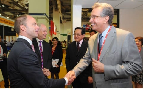 Christian Göke, CEO, Messe Berlin GmbH, and Mike Lee, vice president of sales, Marina Bay Sands, on a VIP Guided Tour at ITB Asia 2014.