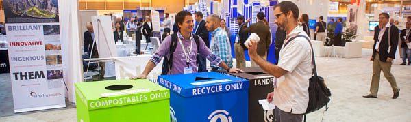 Greenbuild Conference and Expo attendees separate their waste into recycling bins provided by the New Orleans Ernest N. Morial Convention Center.