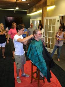 Diagnosed with cancer, Darby's son Cameron cut his back length hair, so it could be donated to Locks of Love.