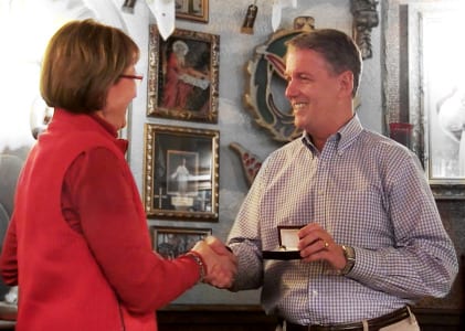 Rosemary Dingmann was awarded a congratulatory ring from Kent Dunham, national sales director.