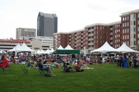 Locals gather for "Green Columbus Earth Day" at outdoor events space.