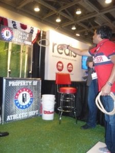 a-line-of-traffic-at-interrels-baseball-themed-booth-featuring-spin-and-win-and-the-triple-play-challenge-ring-toss-375x500