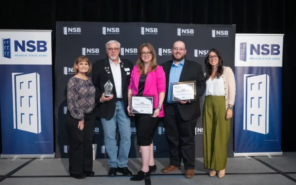 AE&ES leadership team posing at the Vegas Chamber’s 2025 Business of the Year Awards, including Lori Bordman, Gary Bordman, Stefanny Avera, Nathan Domino, and Megan Comfort.