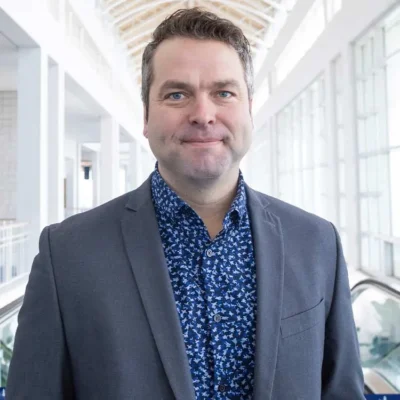 A headshot of Erik Hudson