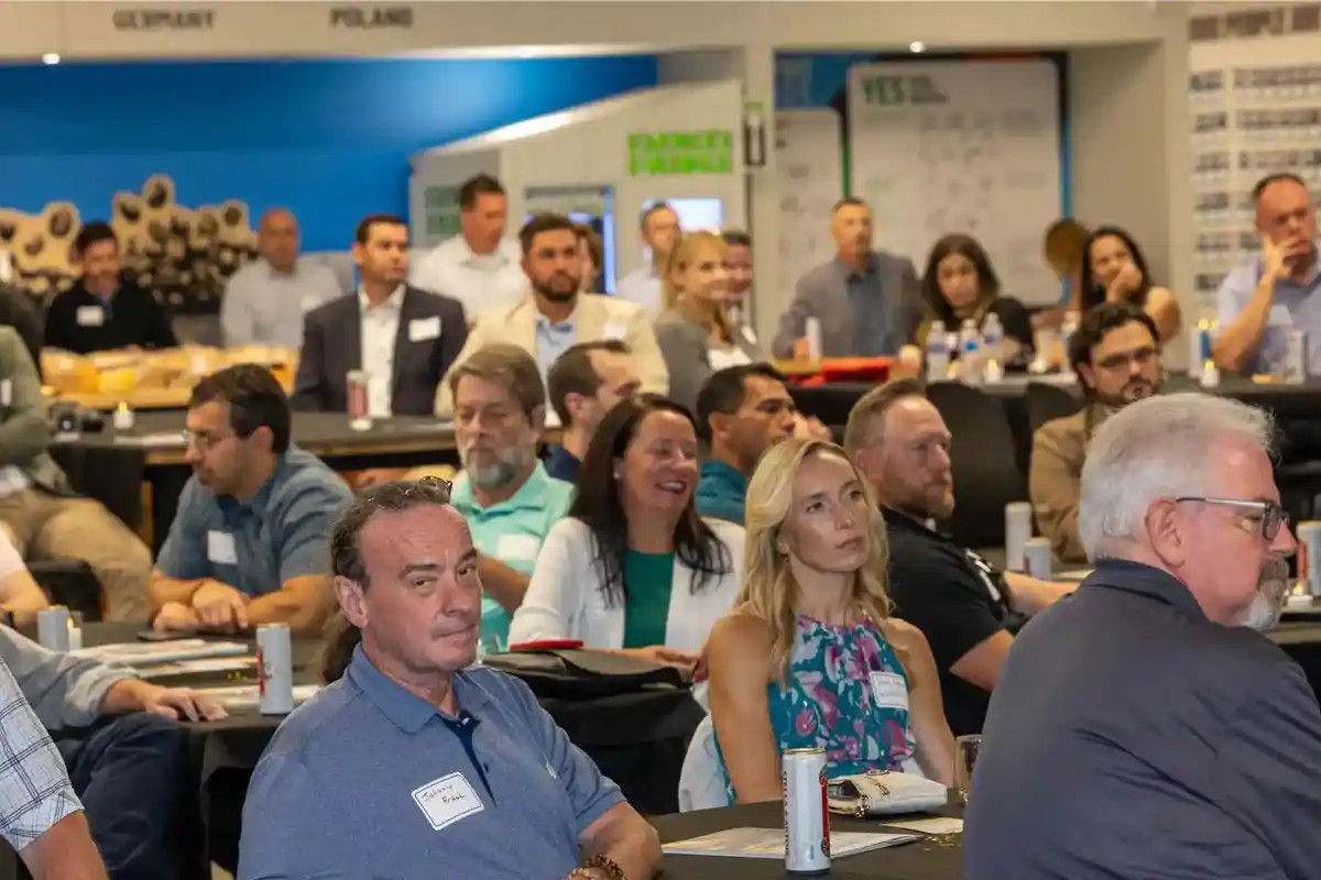 Attendees listen during the 2025 ExSys Awards event at Moss Inc. headquarters in Franklin Park, Illinois.