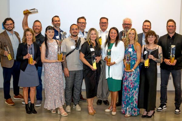 2025 ExSys Awards winners pose with their awards.