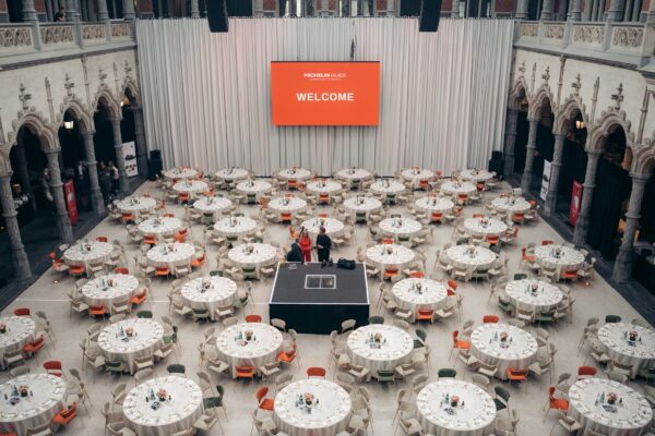 Round tables are set for a MICHELIN Guide event at Handelsbeurs in Antwerp.