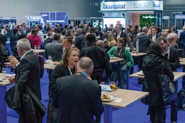 Attendees network on the EAGE Annual Conference and Exhibition show floor.