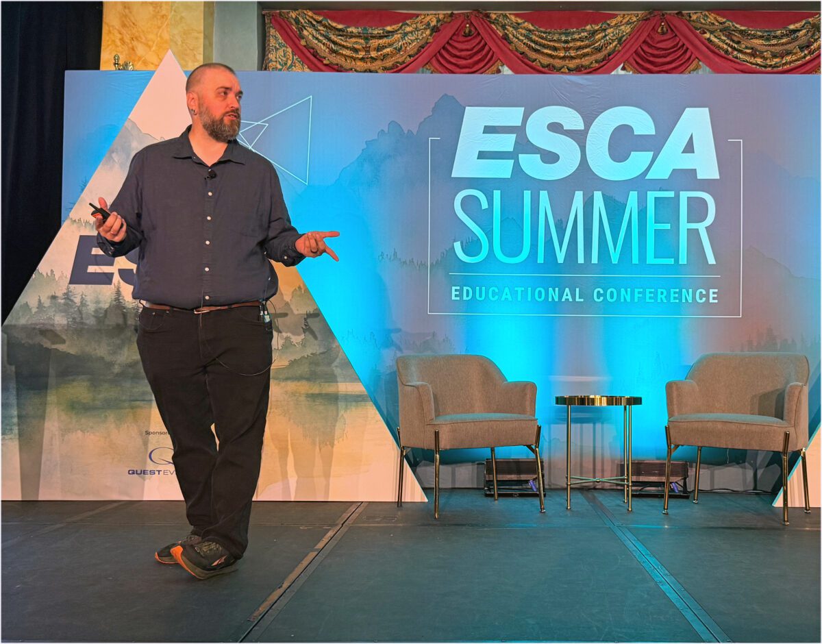 Nick Borelli speaks onstage during the ESCA Summer Educational Conference in Banff.