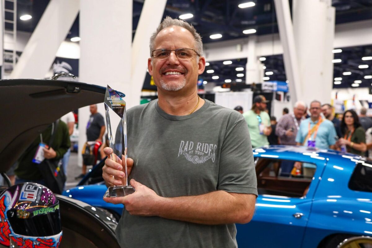 Troy Trepanier holds his 2025 SEMA Battle of the Builders Champion award.