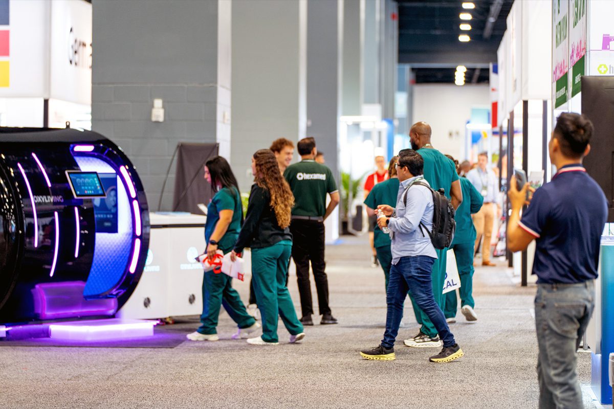 Healthcare professionals walk the WHX Miami 2026 show floor at Miami Beach Convention Center.
