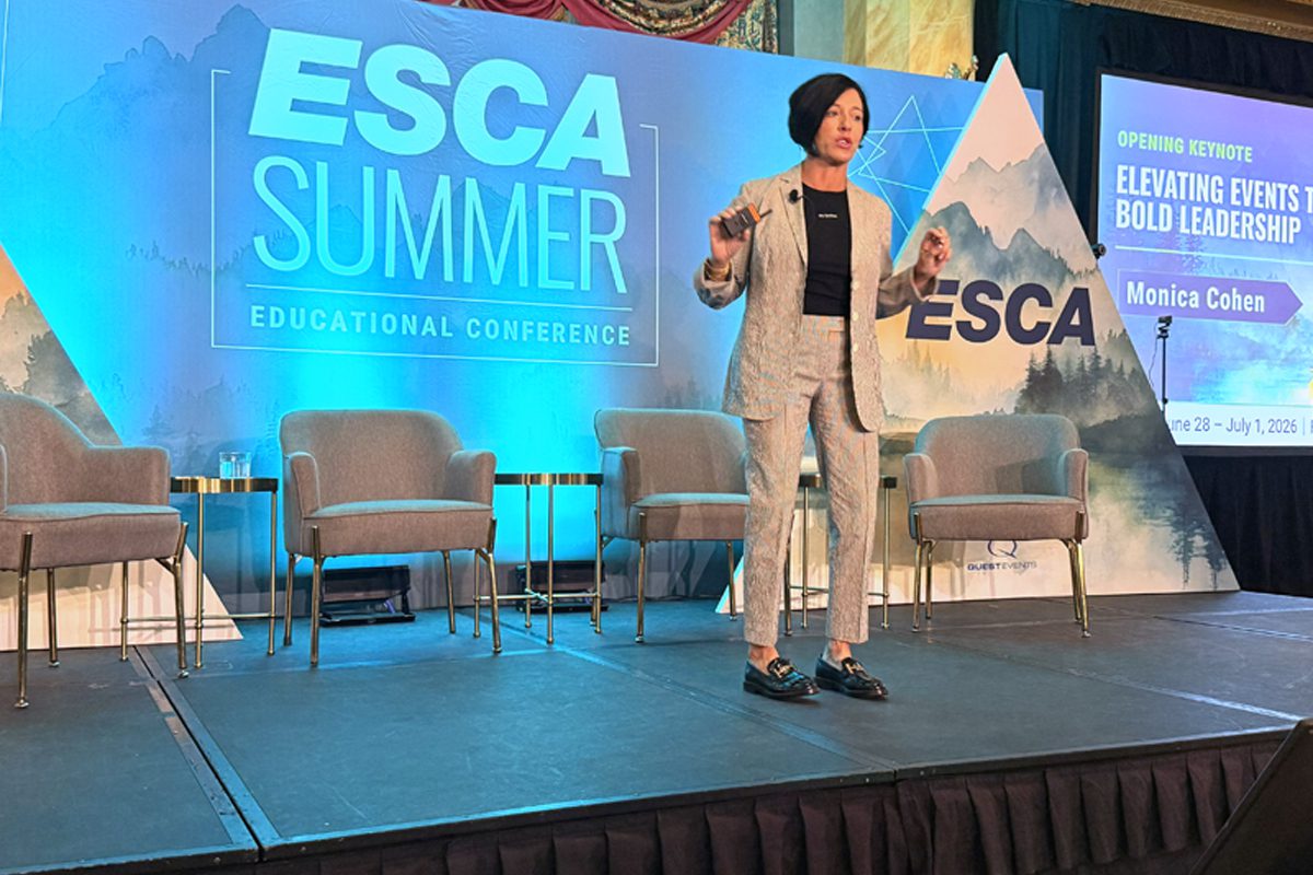 Monica Cohen speaks onstage during the ESCA Summer Educational Conference in Banff.