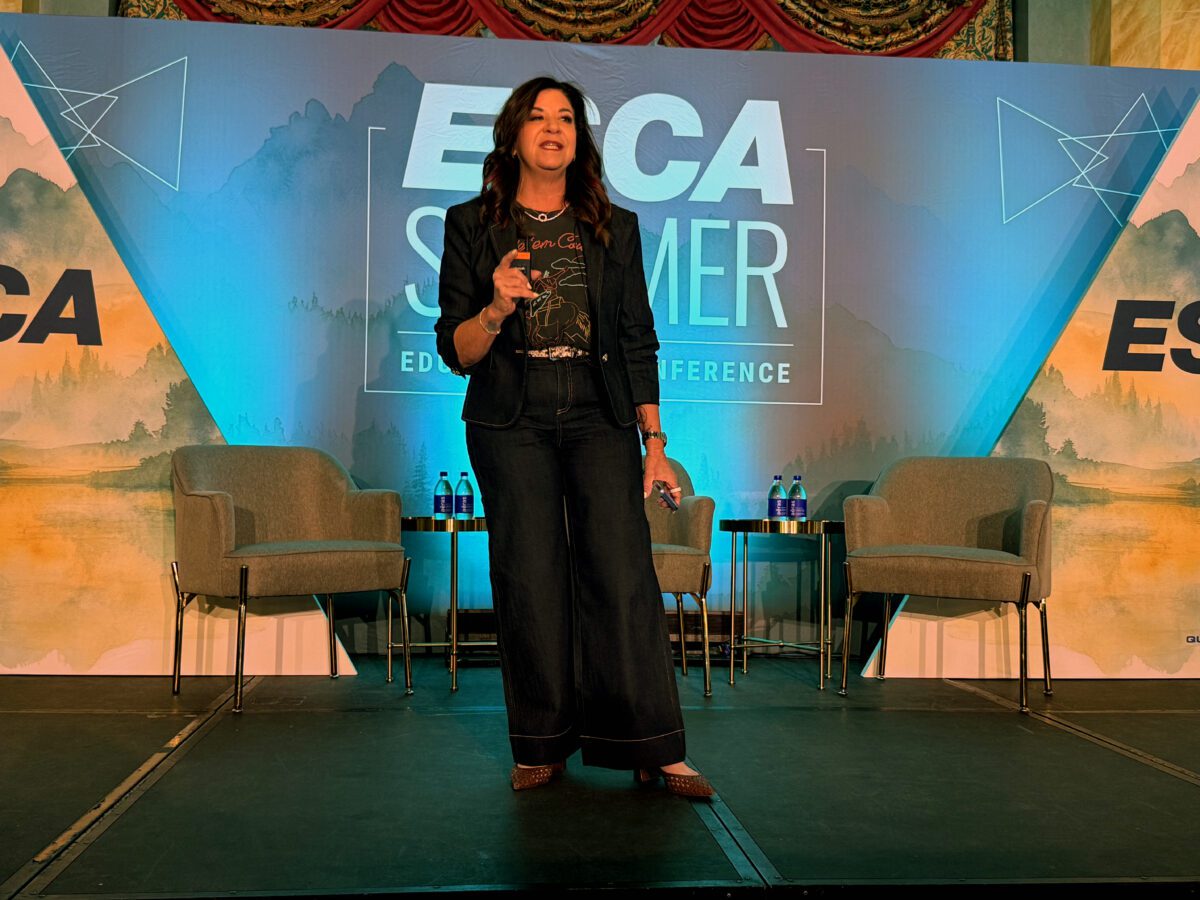 Deb Gabor speaks onstage during the ESCA Summer Educational Conference in Banff.