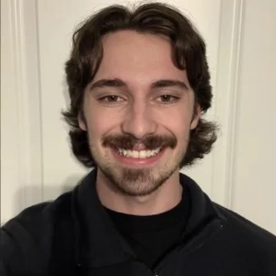 Professional portrait of Austin Corn, sustainability intern at Exhibitus