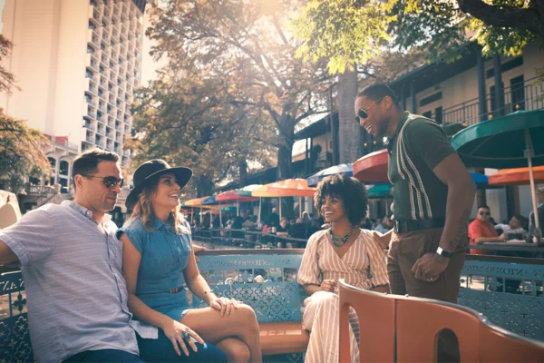 Visitors ride a boat along the San Antonio River Walk near Grand Hyatt San Antonio