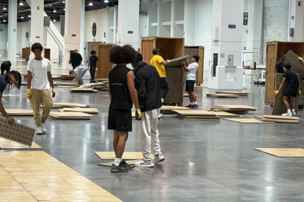 Workers install flooring inside the Las Vegas Convention Center